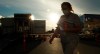 A health-care worker is silhouetted as they walk past the British Columbia mobile medical unit set up outside of Abbotsford Regional Hospital in Abbotsford, B.C. Tuesday, April 14, 2020. The mobile medical unit was deployed to Abbotsford to assist with the COVID-19 outbreak that has occurred at the Mission Correctional Institution. THE CANADIAN PRESS/Jonathan Hayward