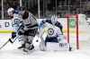 The puck bounces in front of the goal between Winnipeg Jets' Tucker Poolman, left, Los Angeles Kings' Kyle Clifford (13) and Jets goaltender Laurent Brossoit during the second period of the November 30 game in Los Angeles. (Marcio Jose Sanchez / AP Photo)