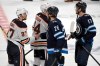 Blake Wheeler shakes hands with Connor McDavid after the Jets eliminated the Oilers in a third overtime period. (Fred Greenslade / The Canadian Press)