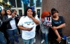 In this March 19, 2020 photo, Bianca Austin composes herself before making remarks during a vigil for her niece, Breonna Taylor, outside the Judicial Center in downtown Louisville, Ky. A prominent civil rights and personal injury attorney has been hired by the family of Breonna Taylor who was fatally shot by Kentucky police in her home. News outlets reported Attorney Ben Crump was hired Monday, May 11, by the family of Breonna Taylor, who was 26 when officers entered her Louisville home early on March 13 as part of a narcotics investigation and fatally shot her. (Sam Upshaw/Courier Journal via AP)