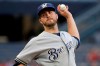 FILE - In this Aug. 7, 2019, file photo, Milwaukee Brewers starting pitcher Drew Pomeranz delivers during the first inning of the team's baseball game against the Pittsburgh Pirates in Pittsburgh. Pomeranz moved to the San Diego Padres for the 2020 season. (AP Photo/Gene J. Puskar, File)