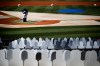 Los Angeles Dodgers special assistant Jose Vizcaino stands on the field during practice as cutouts occupy some of the stadium seats before the team's baseball game against the San Francisco Giants, Sunday, July 26, 2020, in Los Angeles. (AP Photo/Jae C. Hong)