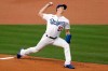 Los Angeles Dodgers starting pitcher Walker Buehler throws to the plate against the Colorado Rockies during the first inning of a baseball game in Los Angeles, Friday, Aug. 21, 2020. (AP Photo/Alex Gallardo)
