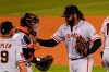 San Francisco Giants starting pitcher Johnny Cueto, right, pats catcher Chadwick Tromp, center, on the chest before being taken out of a baseball game by manager Gabe Kapler during the sixth inning against the Los Angeles Dodgers, Saturday, Aug. 8, 2020, in Los Angeles. (AP Photo/Mark J. Terrill)