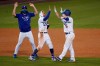 Los Angeles Dodgers' Will Smith, right, gets a virtual high-five from Mookie Betts, center, after Smith drove in the winning run with a single during the 10th inning of the team's baseball game against the Arizona Diamondbacks on Wednesday, Sept. 2, 2020, in Los Angeles. (AP Photo/Marcio Jose Sanchez)