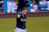Milwaukee Brewers' Orlando Arcia tosses his helmet after striking out during the eighth inning in Game 1 of the team's National League wild-card baseball series against the Los Angeles Dodgers on Wednesday, Sept. 30, 2020, in Los Angeles. (AP Photo/Ashley Landis)