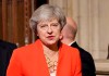 FILE - In this Monday, Oct. 14, 2019 file photo, Britain's former Prime Minister Theresa May walks through the Commons Members Lobby in Parliament, London. British Prime Minister Boris Johnson welcomed the start of a new U.K.-U.S. chapter on Wednesday Jan. 20, 2021, under incoming U.S. President Joe Biden, even as his predecessor Theresa May accused Johnson of “abandoning” the U.K.’s moral leadership in the world during the tumultuous Trump era. (AP Photo/Kirsty Wigglesworth, pool, file)