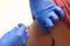 Tribune Media TNS
A health care worker administers a flu vaccine to a woman at a temporary vaccination centre during the second wave of Coronavirus (COVID-19) pandemic on October 16, 2020 in Barcelona, Spain. (David Ramos/Getty Images)