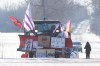 A truck with flags and posters stand near the closed train tracks on ninth day of the train blockade in Tyendinaga, near Belleville, Ont., on Friday Feb. 14, 2020, the protest is in solidarity with the Wet'suwet'en hereditary chiefs opposed to the LNG pipeline in northern British Columbia. THE CANADIAN PRESS/Lars Hagberg