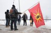 OPP Sgt. Diana Hampson of the liaison team, middle, speaks with members of the Mohawk Territory in Tyendinaga Mohawk Territory, near Belleville, Ont., on Tuesday, Feb. 11, 2020. The members have blocked the CN/VIA train tracks for six days in support of Wet'suwet'en's blockade of natural gas pipeline in northern B.C. THE CANADIAN PRESS/Lars Hagberg