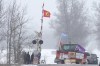 Protesters stand on the closed train tracks during a rail blockade in Tyendinaga Mohawk Territory, Ont. on Thursday, Feb.13, 2020, in solidarity with the Wet'suwet'en hereditary chiefs opposed to the LNG pipeline in northern British Columbia. THE CANADIAN PRESS/Lars Hagberg