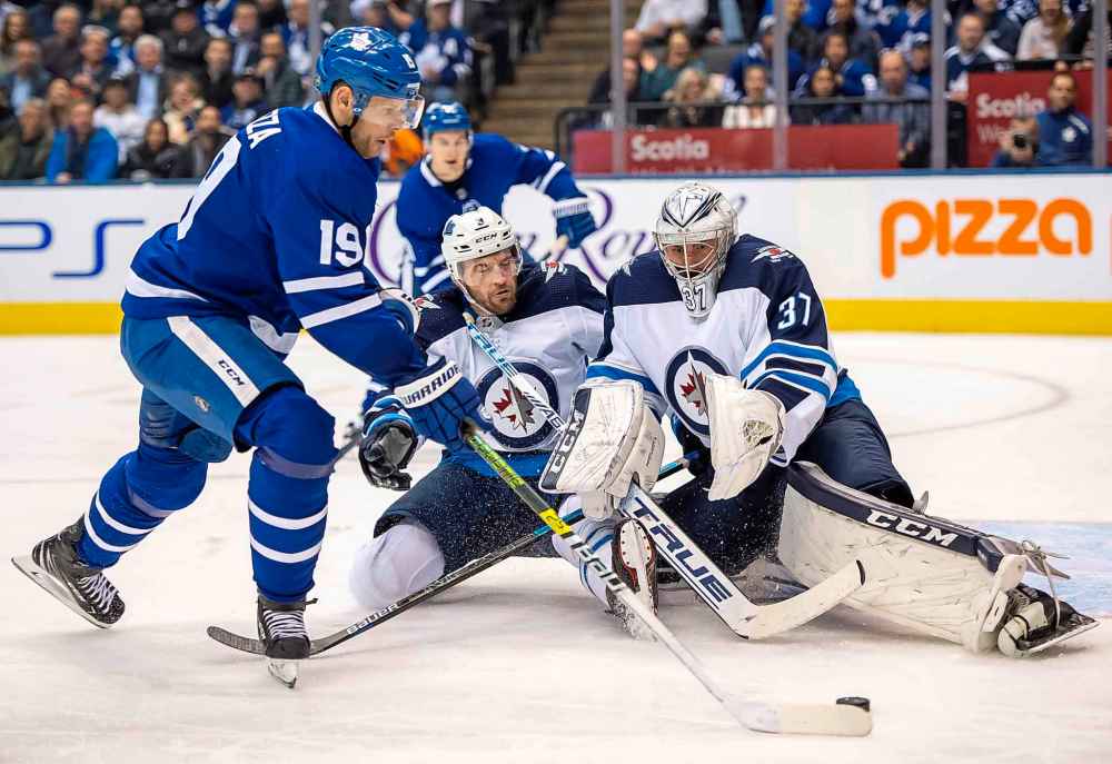 THE CANADIAN PRESS/Frank Gunn
Toronto Maple Leafs centre Jason Spezza shoots on Winnipeg Jets goaltender Connor Hellebuyck  during the second period in Toronto Wednesday.