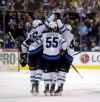 (TREVOR HAGAN / WINNIPEG FREE PRESS)
Winnipeg Jets' Blake Wheeler, Mark Scheifele and Andrew Copp celebrate after Wheeler scored the shootout winning goal against the Toronto Maple Leafs in Toronto, Wednesday.