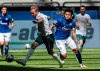 Schalke's Weston McKennie wears an armband reading 