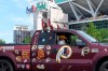 Rodney Johnson of Chesapeake, Va., sits in his truck outside FedEx Field in Landover, Md., Monday, July 13, 2020. The Washington NFL franchise announced Monday that it will drop the 