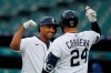 Detroit Tigers' Jonathan Schoop is greeted by teammate Miguel Cabrera after a solo home run to left field during the fourth inning of a baseball game against the Kansas City Royals, Thursday, July 30, 2020, in Detroit. (AP Photo/Carlos Osorio)