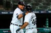 Detroit Tigers' Miguel Cabrera and Jeimer Candelario (46) celebrate scoring on a Niko Goodrum double in the sixth inning of a baseball game against the Chicago Cubs in Detroit, Wednesday, Aug. 26, 2020. (AP Photo/Paul Sancya)