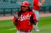 Cincinnati Reds' Freddy Galvis celebrates after scoring against the Detroit Tigers in the seventh inning of the first baseball game of a doubleheader in Detroit, Sunday, Aug. 2, 2020. (AP Photo/Paul Sancya)