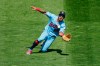 Minnesota Twins left fielder Eddie Rosario slides to make a catch of a ball hit by Kansas City Royals' Hunter Dozier and throws out the runner who ran on the play for a double play in the sixth inning of a baseball game Sunday, Aug. 16, 2020, in Minneapolis. (AP Photo/Bruce Kluckhohn)