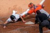 Minnesota Twins' Max Kepler, left, beats the tag by Houston Astros catcher Martin Maldonado to score on a Nelson Cruz double off Astros pitcher Zack Greinke in the third inning of an American League wild-card series baseball game, Tuesday Sept. 29, 2020, in Minneapolis. (AP Photo/Jim Mone)