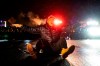 A demonstrator faces off with police outside the Brooklyn Center Police Department while protesting the shooting death of Daunte Wright, late Tuesday, April 13, 2021, in Brooklyn Center, Minn. (AP Photo/John Minchillo)