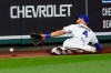 Kansas City Royals left fielder Alex Gordon can't catch a foul ball hit by Detroit Tigers' Victor Reyes during the seventh inning of a baseball game Thursday, Sept. 24, 2020, in Kansas City, Mo. (AP Photo/Charlie Riedel)