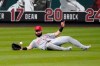 Cincinnati Reds left fielder Jesse Winker is unable to catch a single by St. Louis Cardinals' Kolten Wong during the third inning of a baseball game Saturday, Aug. 22, 2020, in St. Louis. (AP Photo/Jeff Roberson)