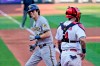 Milwaukee Brewers' Christian Yelich, right, smiles as he looks back at St. Louis Cardinals catcher Yadier Molina, right, after hitting a solo home run during the third inning in the first game of a baseball doubleheader Friday, Sept. 25, 2020, in St. Louis. (AP Photo/Jeff Roberson)