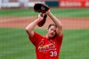 St. Louis Cardinals pitcher Miles Mikolas wipes his face after throwing a simulated inning during baseball practice at Busch Stadium Tuesday, July 7, 2020, in St. Louis. (AP Photo/Jeff Roberson)