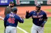 Minnesota Twins' Miguel Sano (22) is congratulated by third base coach Tony Diaz (46) while rounding the bases after hitting a two-run home run during the seventh inning in the first game of a baseball doubleheader against the St. Louis Cardinals Tuesday, Sept. 8, 2020, in St. Louis. (AP Photo/Jeff Roberson)