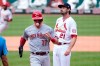 Cincinnati Reds' Tyler Stephenson, left, scores on a wild pitch by St. Louis Cardinals relief pitcher Andrew Miller, right, during the seventh inning of a baseball game Sunday, Sept. 13, 2020, in St. Louis. (AP Photo/Jeff Roberson)