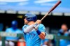 Kansas City Royals Hunter Dozier hits a two-run single during the first inning of a baseball game against the Minnesota Twins at Kauffman Stadium in Kansas City, Mo., Sunday, Aug. 9, 2020. (AP Photo/Orlin Wagner)