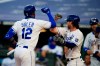 Kansas City Royals' Jorge Soler (12) is congratulated by teammate Brett Phillips, right, after hitting a three-run home run in the fourth inning of a baseball game against the Minnesota Twins at Kauffman Stadium in Kansas City, Mo., Saturday, Aug. 8, 2020. (AP Photo/Orlin Wagner)