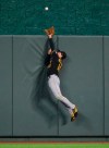 Pittsburgh Pirates center fielder Bryan Reynolds cannot reach a home run off the bat of Kansas City Royals' Adalberto Mondesi during the third inning of a baseball game in Kansas City, Mo., Saturday, Sept. 12, 2020. (AP Photo/Reed Hoffmann)