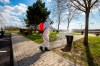 An employee of the national public road maintenance company sprays a litter bin with disinfectant to prevent the spread of the new coronavirus at a rest area of the M70 motorway near Csornyefold, southwestern Hungary, Tuesday, March 10, 2020. The authorities have ordered the disinfection of the entire highway system, with special regards to the motorists' stops. For most people, the new coronavirus causes only mild or moderate symptoms, such as fever and cough. For some, especially older adults and people with existing health problems, it can cause more severe illness, including pneumonia. (Gyorgy Varga/MTI via AP)