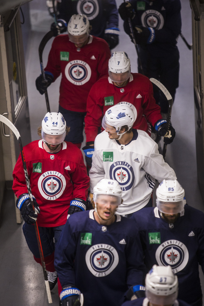 MIKAELA MACKENZIE / WINNIPEG FREE PRESS
Winnipeg Jets players walk to the rink during summer training camp.