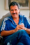 FILE - Alex Trebek poses in his home in Los Angeles, in this July 7, 1988, file photo. Jeopardy!” host Alex Trebek died Sunday, Nov. 8, 2020, after battling pancreatic cancer for nearly two years. Trebek died at home with family and friends surrounding him, “Jeopardy!” studio Sony said in a statement. Trebek presided over the beloved quiz show for more than 30 years.(AP Photo/Alan Greth, File)