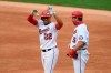 Washington Nationals' Juan Soto (22) reacts at first after his single during the second inning of a baseball game against the New York Mets, Sunday, Sept. 27, 2020, in Washington. Nationals first base coach Bob Henley, right. (AP Photo/Nick Wass)