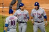 New York Mets Michael Conforto (30) is congratulated by his teammates Ryan Cordell (18) and Wilson Ramos (40) after hitting a home run during the fourth inning of a baseball game against the Washington Nationals in Washington, Tuesday, Aug. 4, 2020. Ramos also scored. (AP Photo/Manuel Balce Ceneta)