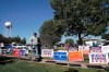 Voters walk past campaign signs at the Graham Civic Center polling location in Graham, N.C., Tuesday, Nov. 3, 2020. (AP Photo/Gerry Broome)