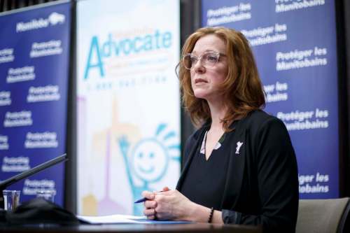 MIKE DEAL / WINNIPEG FREE PRESS Ainsley Krone, acting advocate, Manitoba Advocate for Children and Youth, speaks during an announcement with Families Minister Rochelle Squires at the Manitoba Legislative building Tuesday morning.