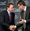 NHL commissioner Gary Bettman (left) and Mark Chipman seal the deal May 31, 2011. (David Lipnowski / The Canadian Press files)