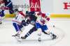 Montreal Canadiens forward Nick Suzuki (left), Winnipeg Jets&rsquo; Kristian Vesalainen and Canadiens forward Tyler Toffoli fight for the puck Friday. (Mikaela MacKenzie / WInnipeg Free Press)