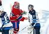 Montreal Canadiens goaltender Carey Price shakes hands with his Winnipeg Jets counterpart Connor Hellebuyck after the Jets were knocked out of the playoffs to end their season. (Paul Chiasson / The Canadian Press files)