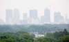 MIKE DEAL / WINNIPEG FREE PRESS
Smoke from rural forest fires hangs over downtown Winnipeg Tuesday afternoon.