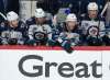 Winnipeg Jets' Adam Lowry, left, watches the final seconds of Game 3 with teammates Blake Wheeler (26), Paul Stastny (25) and Nikolaj Ehlers (27) during third period NHL Stanley Cup playoff hockey action against the Montreal Canadiens, in Montreal, Sunday, June 6, 2021. Montreal beat the Jets to take a 3-0 lead in the series. THE CANADIAN PRESS/Ryan Remiorz