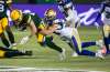 Winnipeg Blue Bombers&rsquo; Jesse Briggs tackles Edmonton Elks&rsquo; Greg Ellingson Friday night in Edmonton. The Bombers clinched a playoff spot with a shaky victory. (Jason Franson / The Canadian Press files)