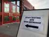 The testing site entrance for unvaccinated school employees at the senior gymnasium at Grant Park High School. (Maggie MacIntosh / Winnipeg Free Press)