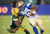 Jason Franson / The Canadian Press files
Winnipeg Blue Bombers' Johnny Augustine (27) is tackled by Edmonton Elks' Darius Williams (29) during first half CFL action in Edmonton, Alta., on Saturday, September 18, 2021.