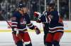 Winnipeg Jets' Nate Schmidt and Josh Morrissey celebrate Schmidt's goal against the San Jose Sharks during second period NHL action in Winnipeg on Thursday. THE CANADIAN PRESS/John Woods